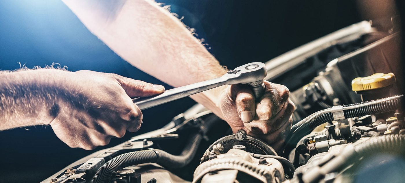 Mechanic servicing a car